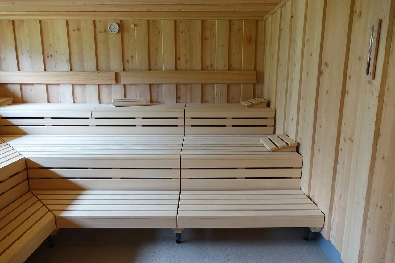 Tiered wooden sauna benches at different heights